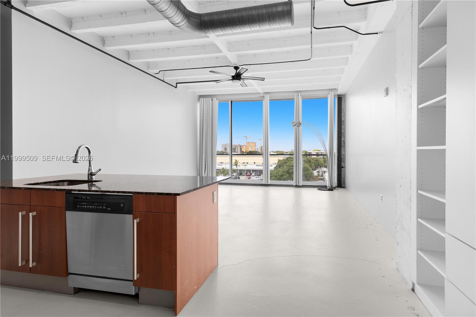 8101 Biscayne Boulevard, Unit R414 Miami, FL 33138 - Photo 3 of 27 a kitchen with stainless steel appliances a sink stove and cabinets
