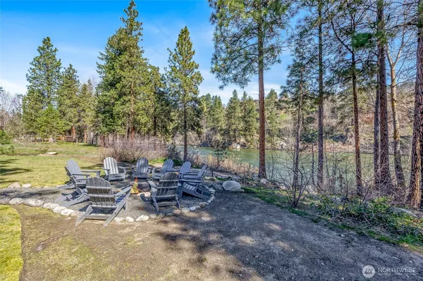 a view of a lake with outdoor seating