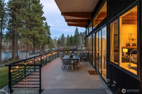 a view of two chairs in the balcony