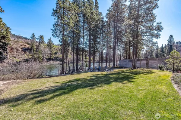 a swimming pool with trees in the background