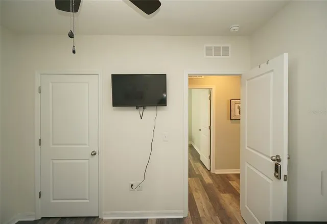 a view of a livingroom with wooden floor