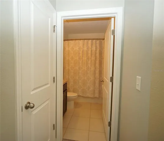 a bathroom with a glass door shower