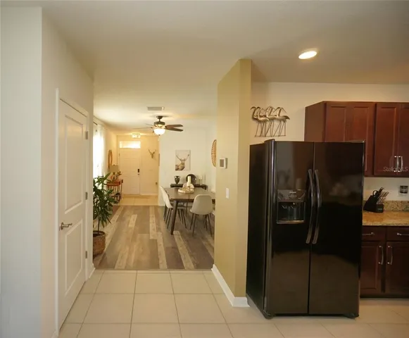 a kitchen with stainless steel appliances a refrigerator and a counter top space