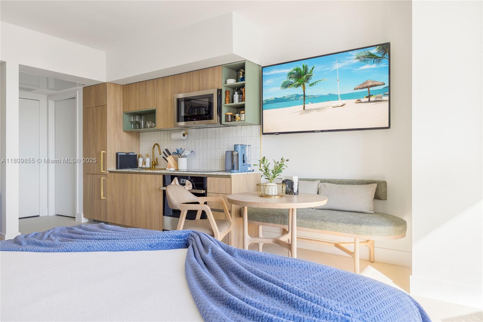 159 Northeast 6th Street, Unit 3012 Miami, FL 33132 - Photo 16 of 91 a living room with furniture wooden floor and a flat screen tv