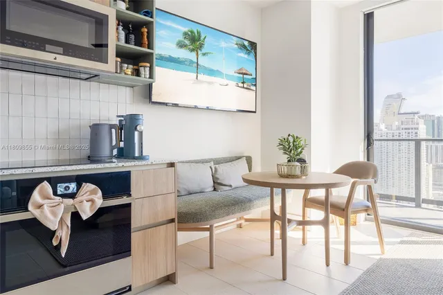 a outdoor dining space with furniture and outdoor view