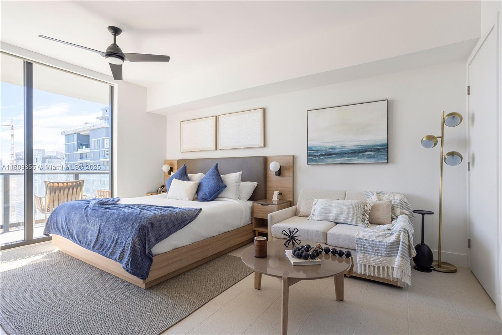 159 Northeast 6th Street, Unit 3012 Miami, FL 33132 - Photo 2 of 91 a spacious bedroom with a bed and a chandelier