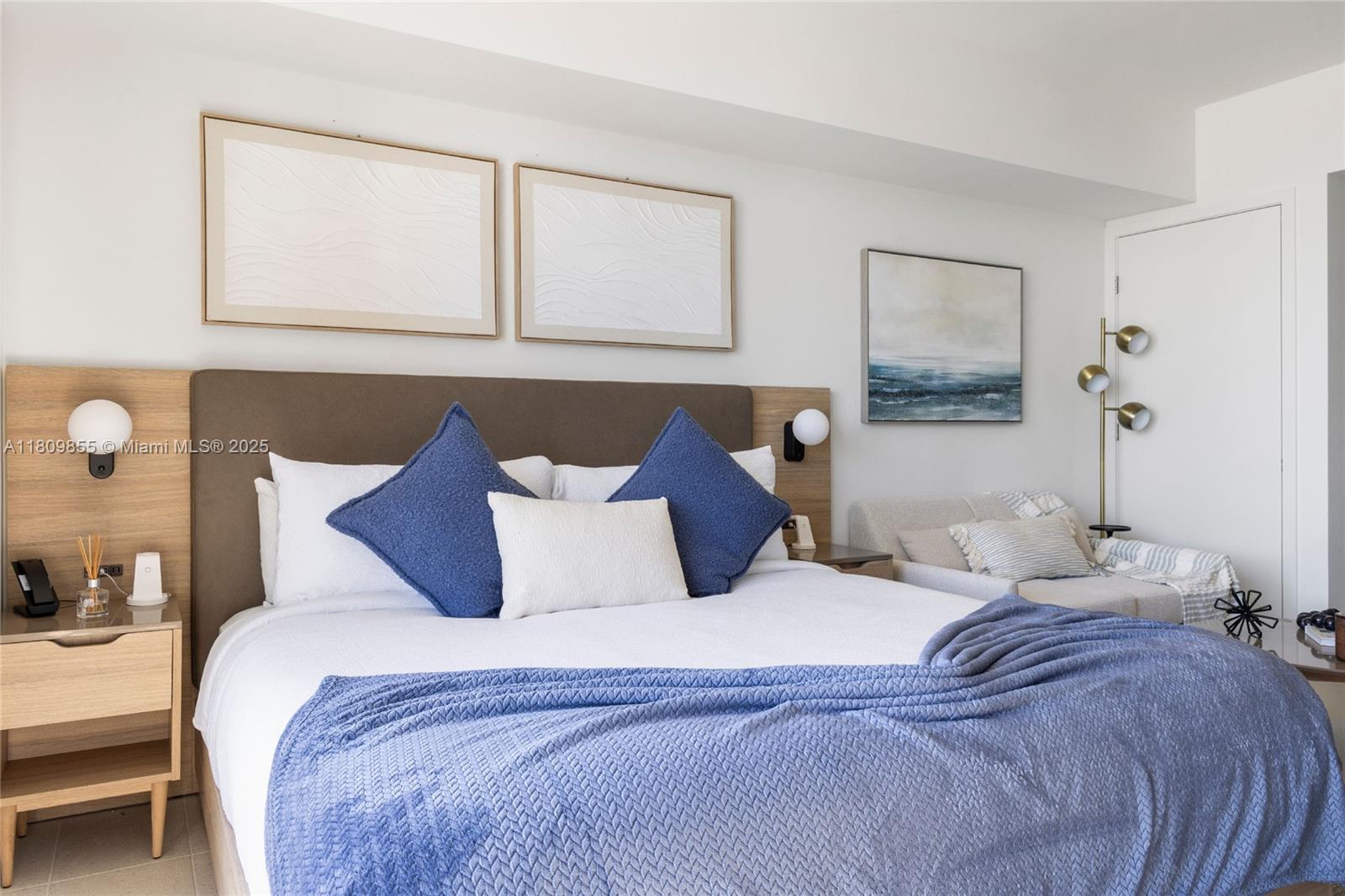 159 Northeast 6th Street, Unit 3012 Miami, FL 33132 - Photo 7 of 91 a bedroom with a large bed and a painting on the wall