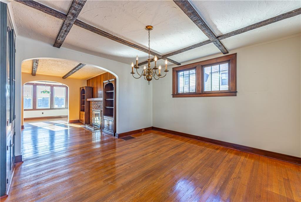 422 New Castle Road Butler, PA 16001 - Photo 10 of 27 a view of a room with wooden floor chandelier and entryway