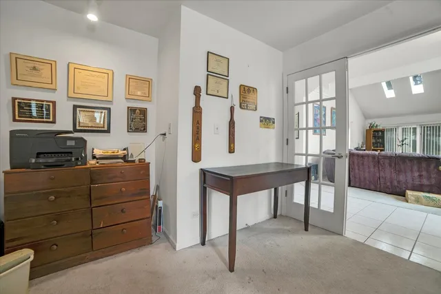 a view of hall way with furniture