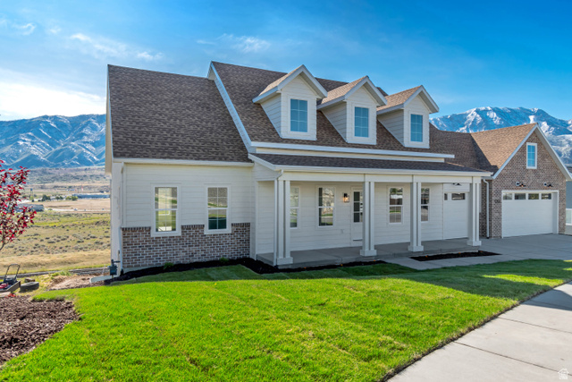 1351 Maple Circle Santaquin, UT 84655 - Photo 3 of 42 Contemporary colonial exterior featuring white siding and brick accents