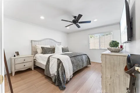 a bathroom with a granite countertop sink a toilet and a mirror