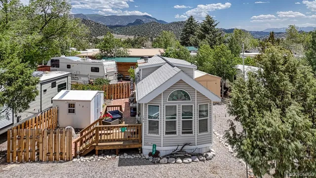 an aerial view of a house with a yard