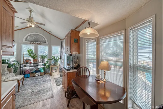 a kitchen with stainless steel appliances a stove a sink and a refrigerator