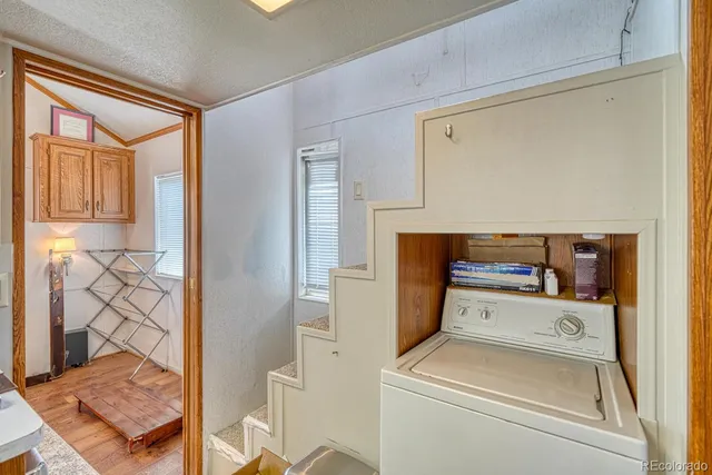 a kitchen with stainless steel appliances granite countertop a sink and a wooden cabinets