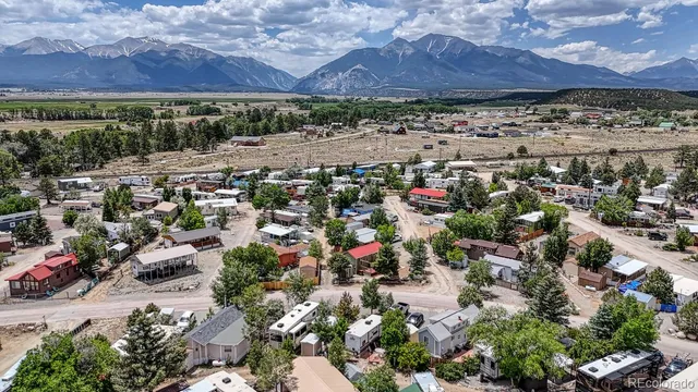 an aerial view of multiple houses with yard