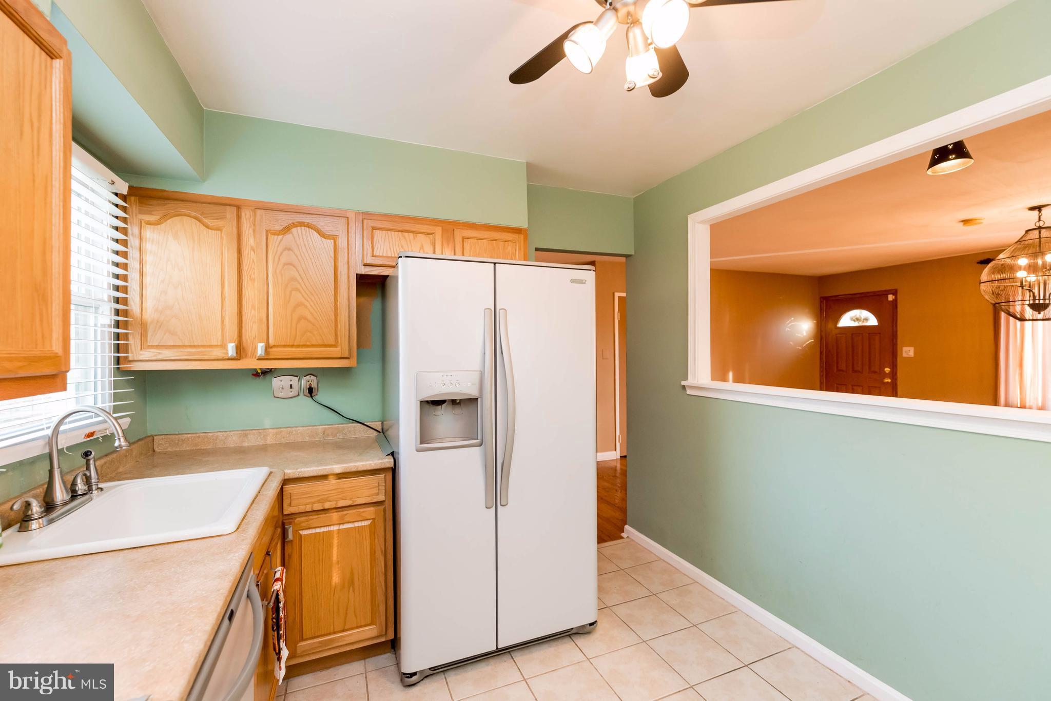 810 Crosby Road Baltimore, MD 21228 - Photo 8 of 30 a kitchen with stainless steel appliances granite countertop a refrigerator and a sink