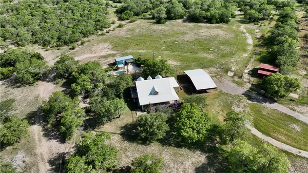 an aerial view of a house with outdoor space and street view