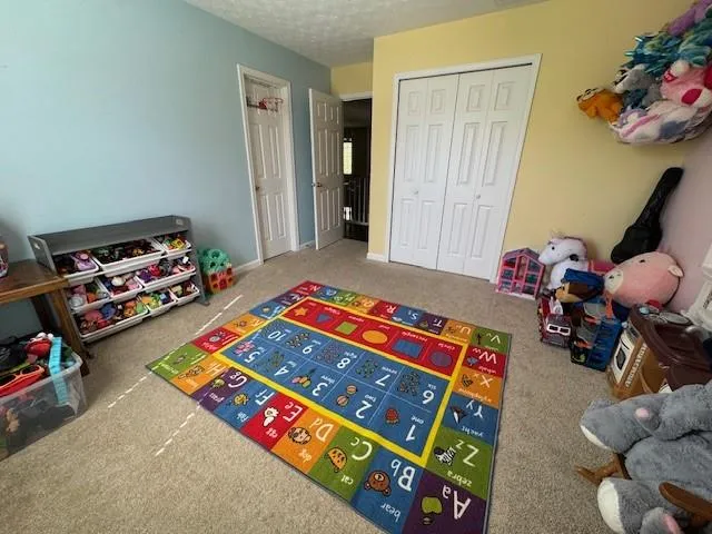 a room with toys and wooden floor