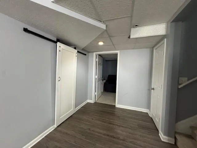 a view of hallway with wooden floor
