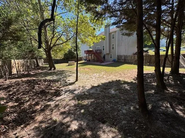 a view of a yard with trees