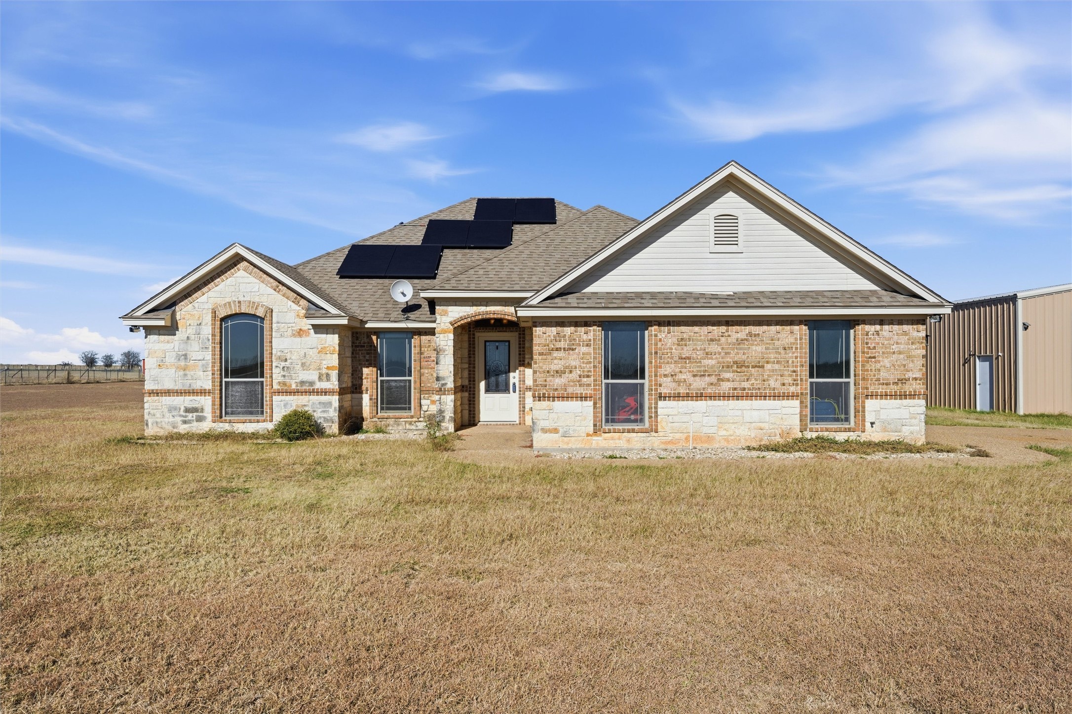 a front view of a house with a outdoor space