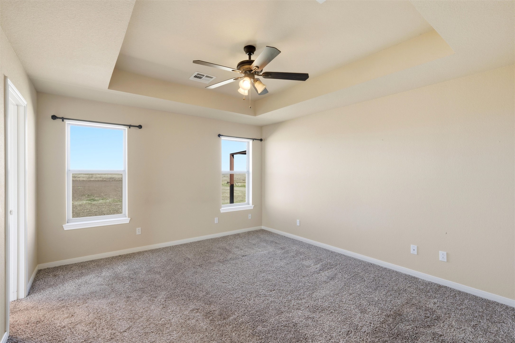 870 Patton Road Valley Mills, TX 76689 - Photo 14 of 29 an empty room with windows and fan