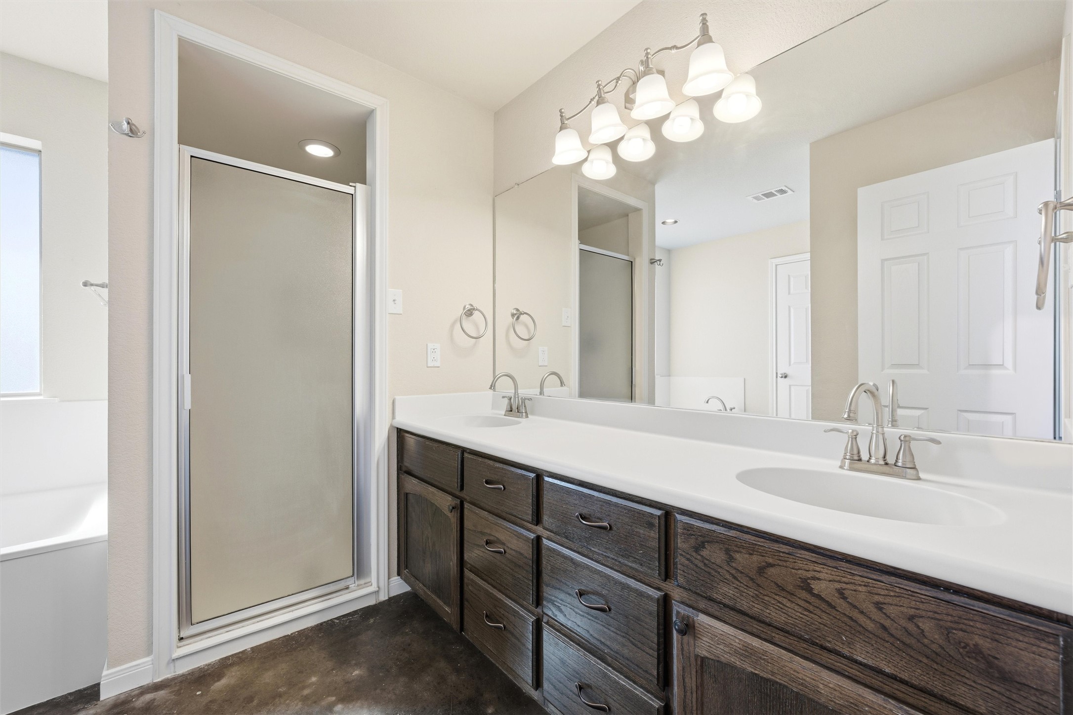 870 Patton Road Valley Mills, TX 76689 - Photo 15 of 29 a bathroom with double vanity sinks a vanity a lamp and a mirror