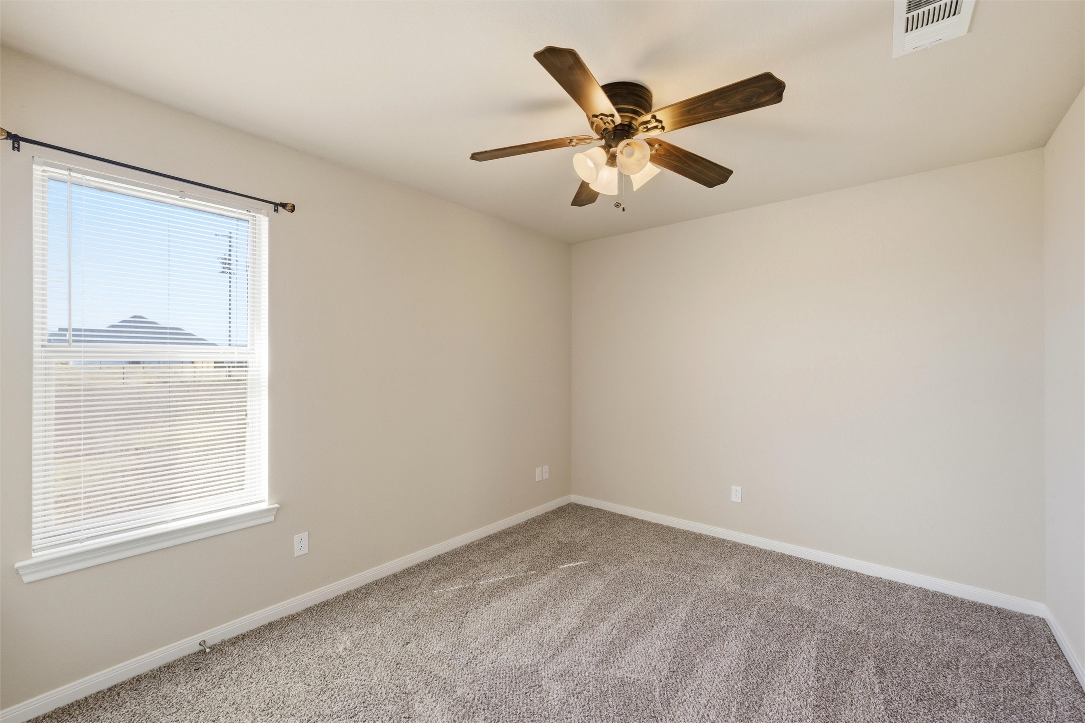 870 Patton Road Valley Mills, TX 76689 - Photo 17 of 29 an empty room with a window and a fan