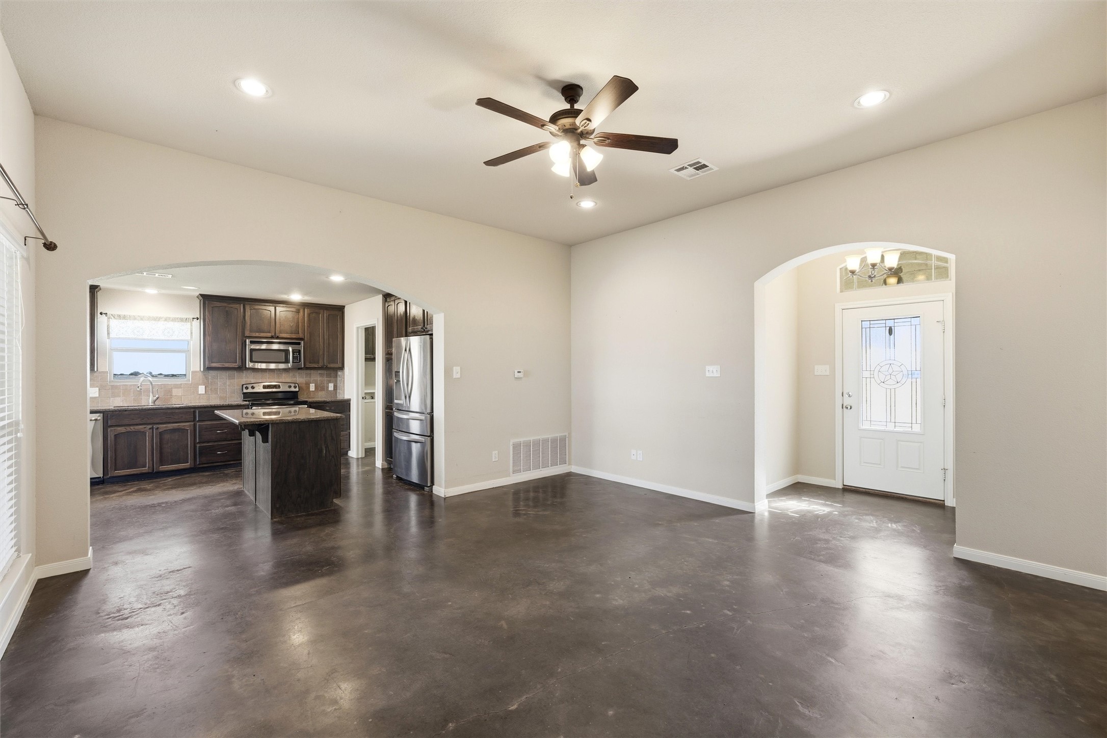 870 Patton Road Valley Mills, TX 76689 - Photo 4 of 29 an open kitchen with a sink and stainless steel appliances