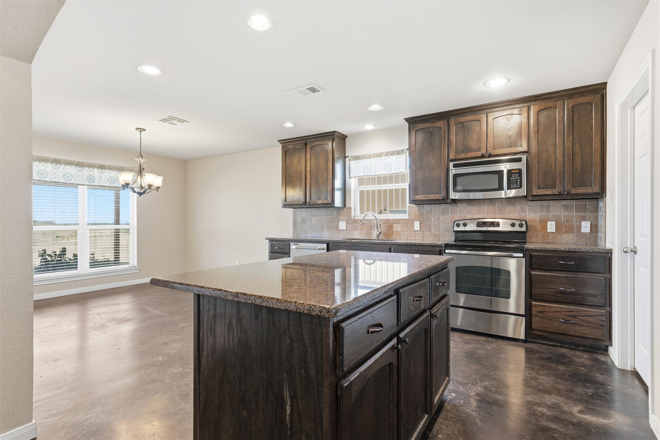 870 Patton Road Valley Mills, TX 76689 - Photo 8 of 29 a kitchen with a sink stove top oven and microwave
