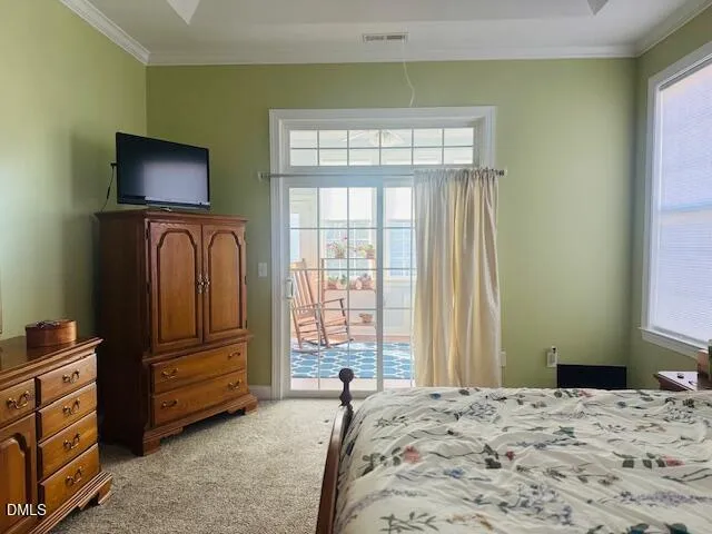 a bedroom with a bed and a television