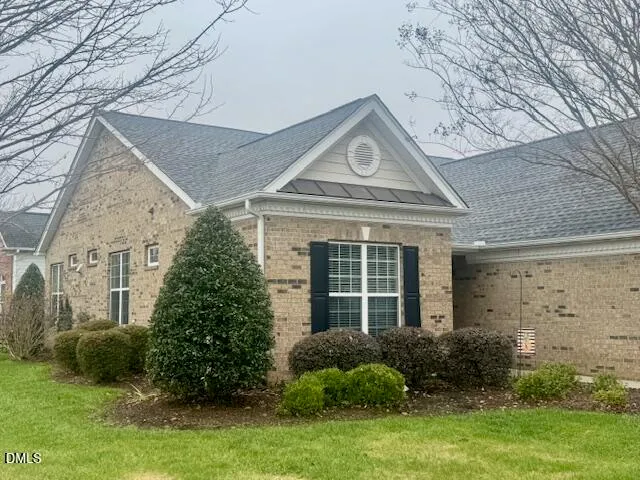 a view of a patio with table and chairs and potted plants