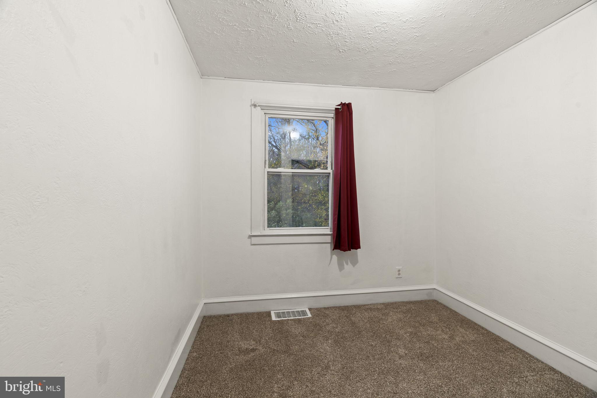 15 North Miller Avenue Carneys Point, NJ 08069 - Photo 11 of 18 a view of an empty room with a window