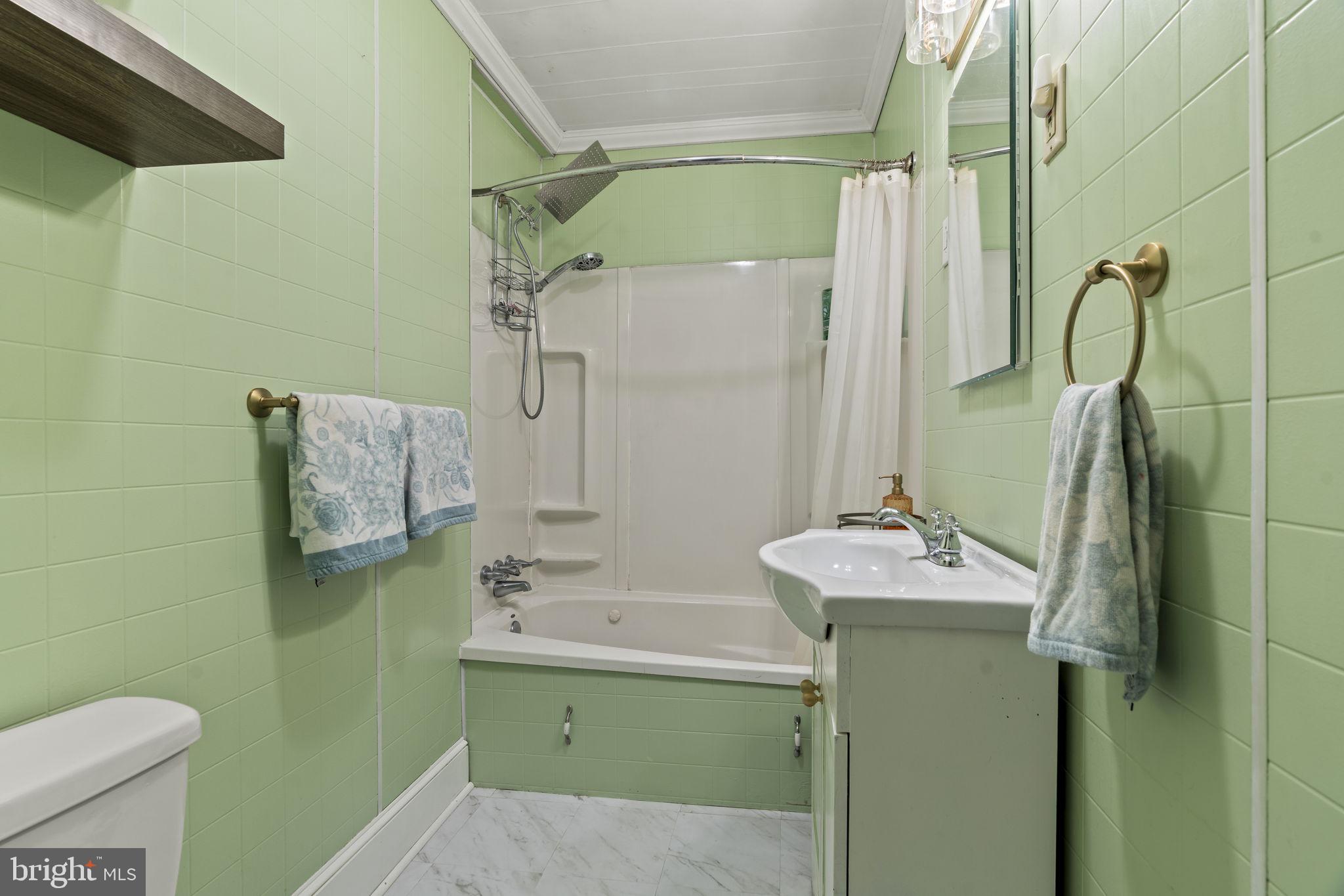 15 North Miller Avenue Carneys Point, NJ 08069 - Photo 12 of 18 a bathroom with a sink toilet and shower