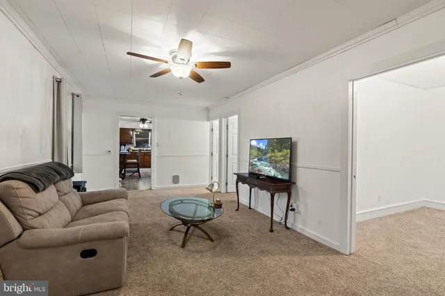 a living room with furniture and a rug