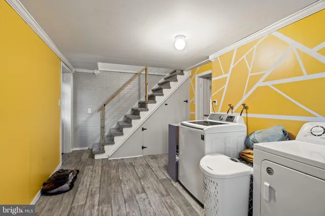 a view of storage and utility room with washer and dryer