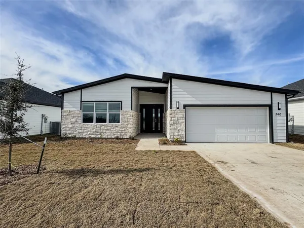a house with yard in front of it