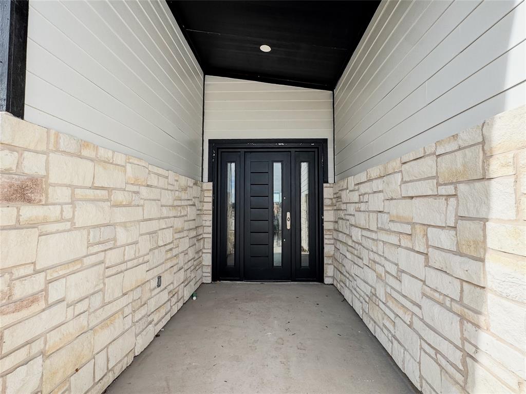340 Lucy Road Greenville, TX 75402 - Photo 2 of 19 a view of wooden door