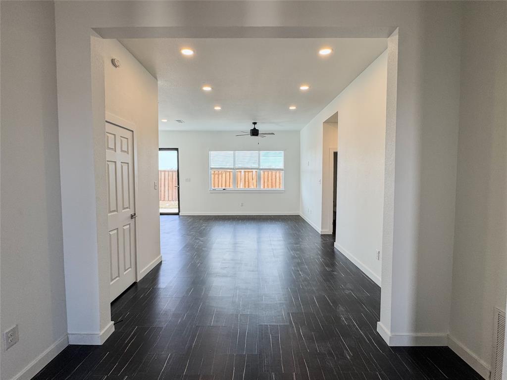 340 Lucy Road Greenville, TX 75402 - Photo 3 of 19 wooden floor in an empty room with wooden floor