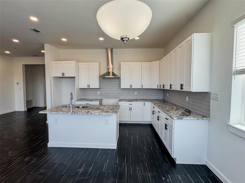 340 Lucy Road Greenville, TX 75402 - Photo 7 of 19 a kitchen with a sink stove and cabinets