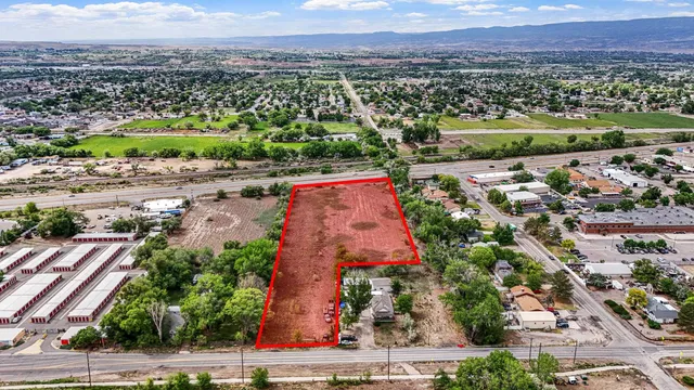 an aerial view of residential houses and outdoor space