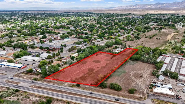 an aerial view of a residential houses with street