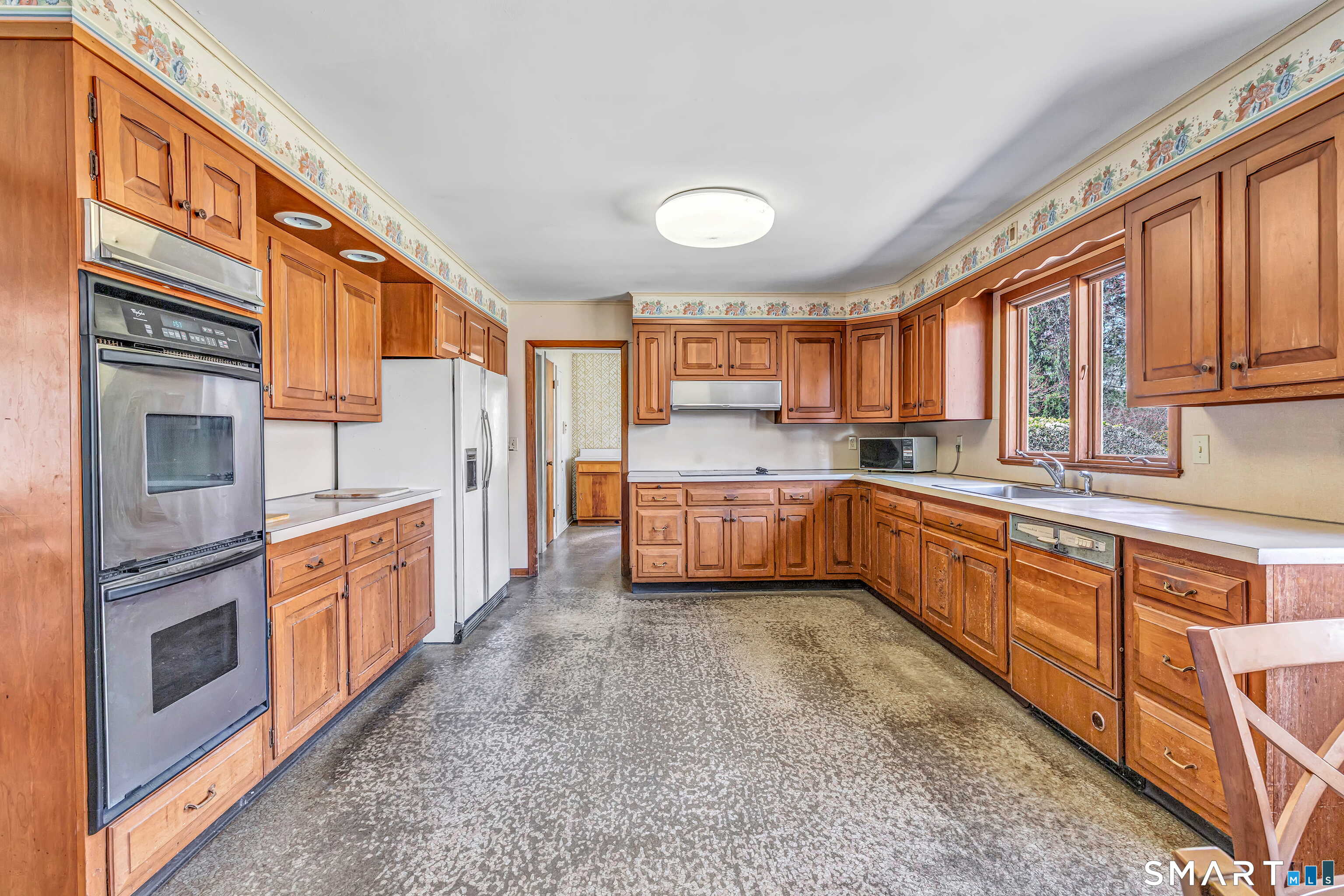160 Sport Hill Road Easton, CT 06612 - Photo 11 of 40 a kitchen with stainless steel appliances granite countertop a stove top oven a sink dishwasher a refrigerator and cabinets with wooden floor