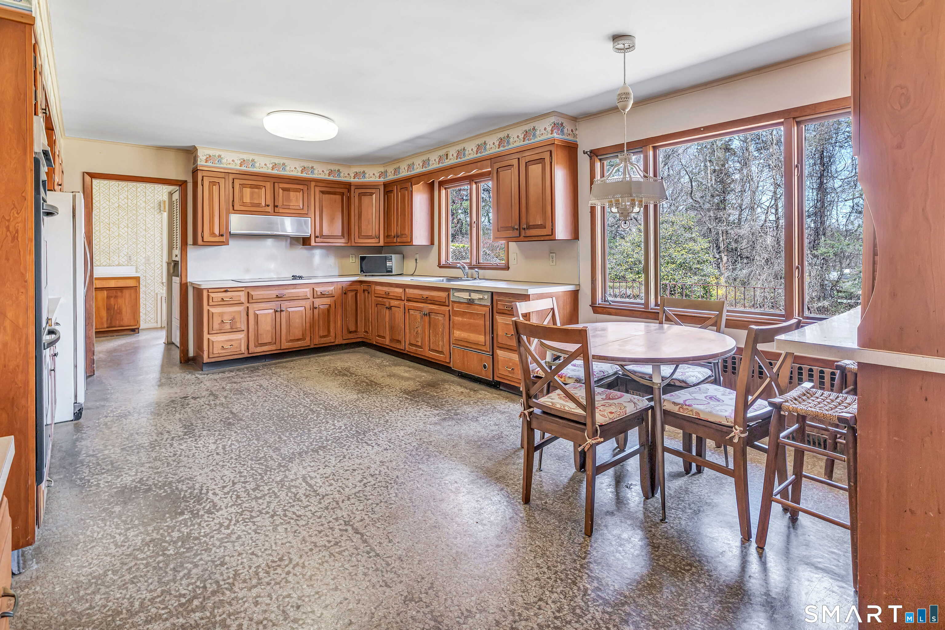 160 Sport Hill Road Easton, CT 06612 - Photo 12 of 40 a dining room with a wooden table and chairs
