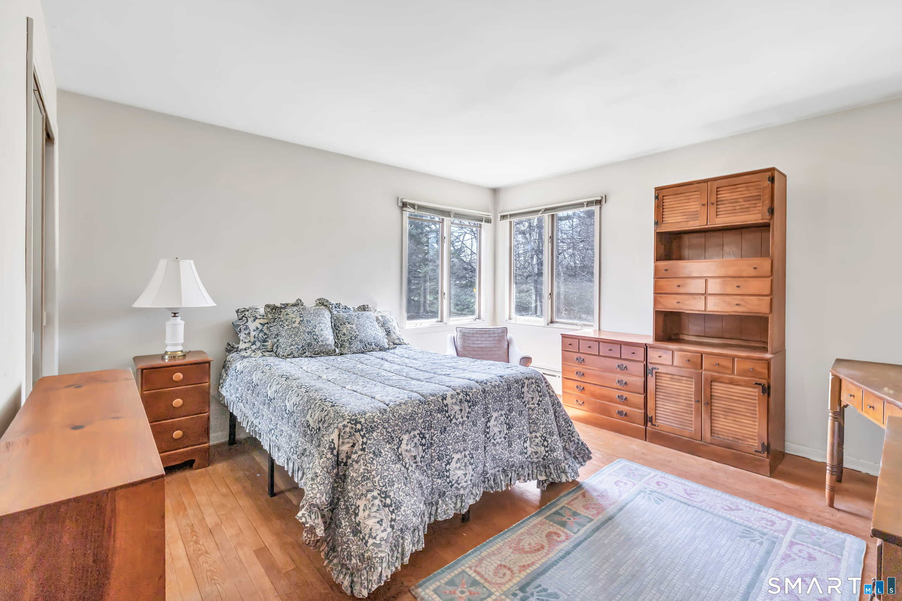 160 Sport Hill Road Easton, CT 06612 - Photo 27 of 40 a bedroom with a bed and wooden floor