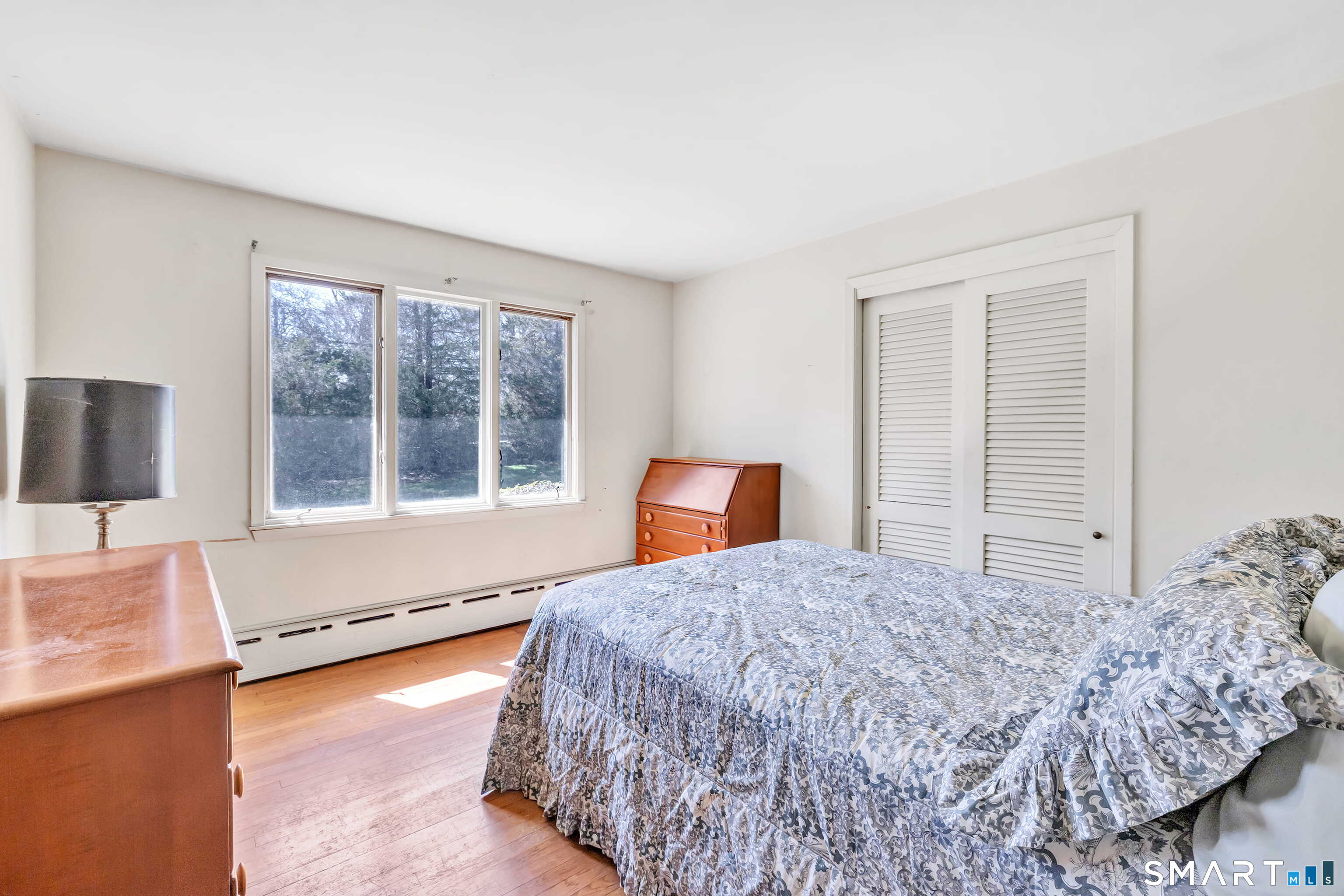 160 Sport Hill Road Easton, CT 06612 - Photo 29 of 40 a bedroom with a bed and a large window