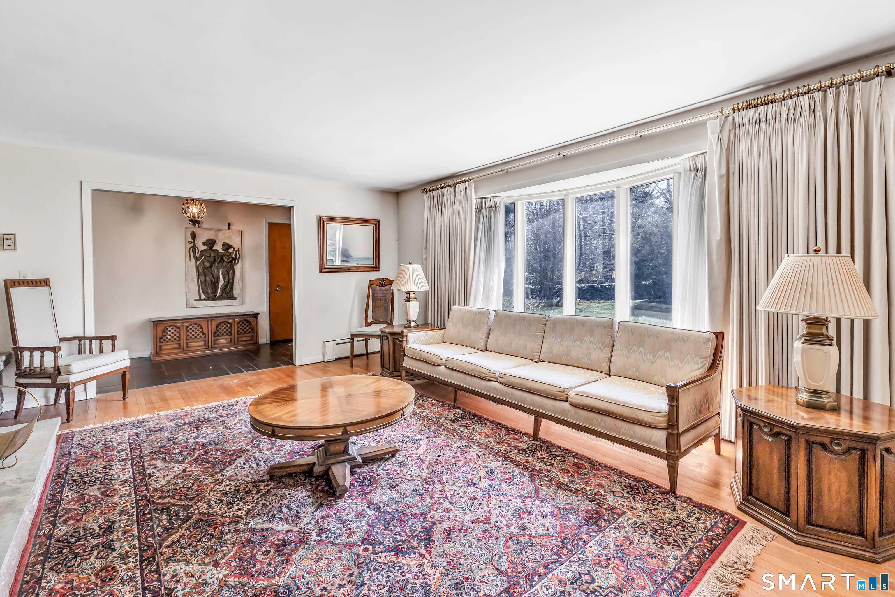 160 Sport Hill Road Easton, CT 06612 - Photo 7 of 40 a living room with furniture a rug and a window