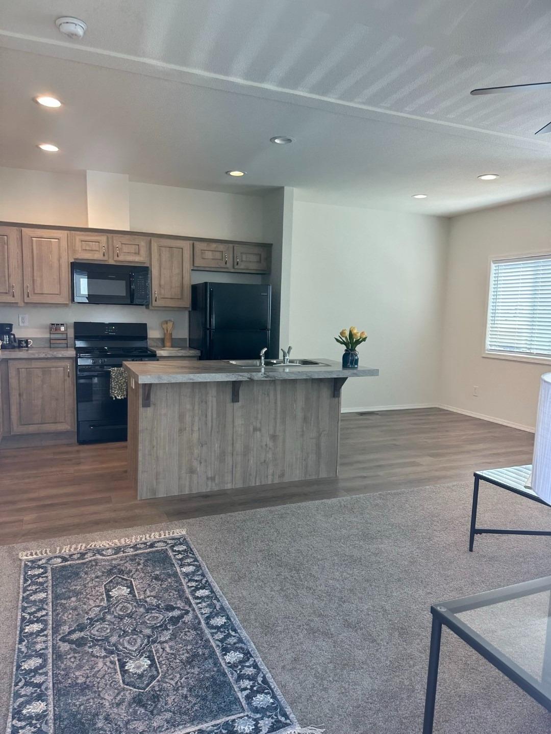 1354 Elliott Road, Unit 4 Paradise, CA 95969 - Photo 1 of 1 a view of kitchen with stainless steel appliances wooden floor and living room