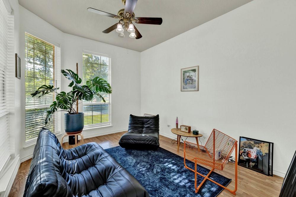 18 Equestrian Court Mansfield, TX 76063 - Photo 13 of 28 a living room with furniture and a potted plant