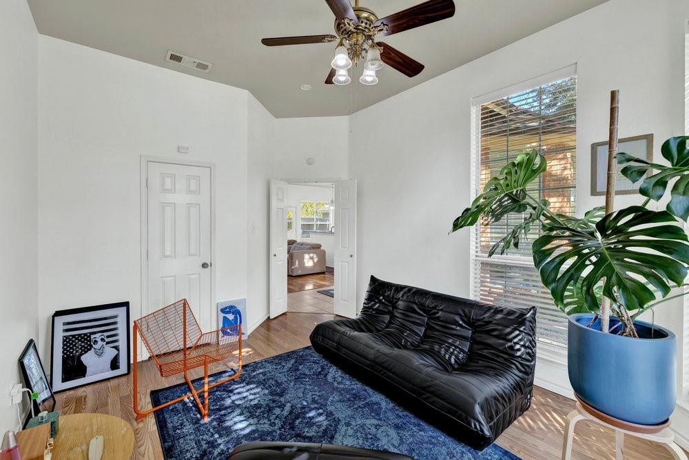 18 Equestrian Court Mansfield, TX 76063 - Photo 14 of 28 a living room with furniture potted plant and a window